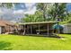 Spacious backyard featuring a large covered area, perfect for outdoor activities and entertaining at 5209 Sterrett St, North Charleston, SC 29405
