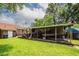 Lush backyard with covered outdoor cooking area, boat storage and well maintained lawn at 5209 Sterrett St, North Charleston, SC 29405
