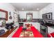 Bright kitchen featuring white cabinets, stainless steel appliances, and a dining area at 5209 Sterrett St, North Charleston, SC 29405