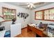Home office with wood floors, a large desk, and plenty of natural light at 5209 Sterrett St, North Charleston, SC 29405