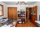 Office area with wood floors, a desk with office supplies and a bookcase at 5209 Sterrett St, North Charleston, SC 29405