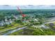 Aerial view showcasing the property's location within a scenic neighborhood near winding waterways and lush greenery at 544 Two Mile Run, Johns Island, SC 29455