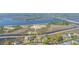 Stunning aerial of waterfront community, showing homes with marsh views and a bridge in the background at 544 Two Mile Run, Johns Island, SC 29455