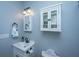 Charming bathroom featuring white cabinetry, stylish fixtures, and soft blue walls at 544 Two Mile Run, Johns Island, SC 29455
