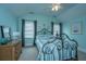 Comfortable bedroom with a wrought iron bed, dresser, and natural light from two windows at 544 Two Mile Run, Johns Island, SC 29455