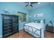 Cozy bedroom with a metal frame bed, ceiling fan, and dresser for a comfortable retreat at 544 Two Mile Run, Johns Island, SC 29455