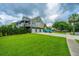 Charming home with a three-car garage, screened porch, and lush landscaping, blending comfort and style at 544 Two Mile Run, Johns Island, SC 29455