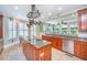 Bright open kitchen with granite counters, central island, stainless appliances, and dining area at 544 Two Mile Run, Johns Island, SC 29455