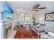 Bright and airy living room with hardwood floors, fireplace, and backyard access at 544 Two Mile Run, Johns Island, SC 29455