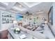 Elegant living room with hardwood floors, fireplace, coffered ceilings, and French doors offering abundant natural light at 544 Two Mile Run, Johns Island, SC 29455