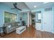 Living room with wood floors, a gray sofa, a ceiling fan, and natural light at 544 Two Mile Run, Johns Island, SC 29455