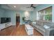 Living room with wood floors, a gray sofa, and a bike decoration at 544 Two Mile Run, Johns Island, SC 29455