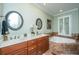 Luxurious main bathroom with double vanities, a soaking tub, and marble accents for a spa-like experience at 544 Two Mile Run, Johns Island, SC 29455