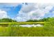 Scenic view of serene marshland with tranquil waters and lush vegetation, showcasing the natural beauty at 544 Two Mile Run, Johns Island, SC 29455