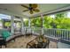 Cozy screened porch with comfortable seating, outdoor decor, and a view of the lush surroundings at 544 Two Mile Run, Johns Island, SC 29455