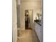 Bright bathroom featuring double vanity, black countertop, neutral tile and a walk-in closet at 556 Sea Foam St, Summerville, SC 29486