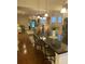 Open-concept kitchen with an island featuring bar seating and modern pendant lighting at 556 Sea Foam St, Summerville, SC 29486