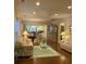 Bright living room with hardwood floors, a ceiling fan, and an open floor plan at 556 Sea Foam St, Summerville, SC 29486