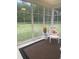 Bright sunroom with views of the landscaped backyard and lots of natural light at 556 Sea Foam St, Summerville, SC 29486