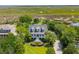 Stunning aerial view of a classic home with lush landscaping and scenic surroundings at 591 Island Walk East, Mount Pleasant, SC 29464