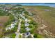 Expansive aerial shot of a lovely neighborhood by the water, surrounded by greenery at 591 Island Walk East, Mount Pleasant, SC 29464