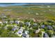 Breathtaking aerial view showcasing a neighborhood with beautiful homes and waterfront access at 591 Island Walk East, Mount Pleasant, SC 29464