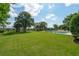Expansive backyard with a sparkling pool and multiple lounge chairs amid mature trees at 591 Island Walk East, Mount Pleasant, SC 29464