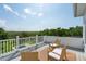 Relaxing rooftop deck with wicker seating and scenic marsh views with a partial view of the pool at 591 Island Walk East, Mount Pleasant, SC 29464