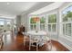 Cozy dining area featuring large windows with plantation shutters and lovely outdoor views at 591 Island Walk East, Mount Pleasant, SC 29464