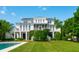 Gorgeous home featuring a multilevel deck overlooking the pristine pool and landscaped backyard at 591 Island Walk East, Mount Pleasant, SC 29464
