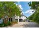 Beautiful home exterior with manicured landscaping, two-car garage, and private driveway at 591 Island Walk East, Mount Pleasant, SC 29464