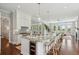 Well-appointed kitchen with large island, pendant lighting, stainless steel appliances, and modern finishes at 591 Island Walk East, Mount Pleasant, SC 29464