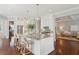 Gourmet kitchen with granite countertops, white cabinets, and island with seating for entertaining at 591 Island Walk East, Mount Pleasant, SC 29464