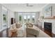 Bright living room with fireplace, hardwood floors, neutral colors, and french doors to the outside deck at 591 Island Walk East, Mount Pleasant, SC 29464