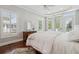 Serene main bedroom featuring stylish ensuite bathroom and access to a private outdoor deck at 591 Island Walk East, Mount Pleasant, SC 29464