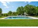 A sparkling pool with inviting lounge chairs set against a lush, green backdrop at 591 Island Walk East, Mount Pleasant, SC 29464