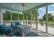 Relaxing screened porch with comfortable seating and views of the picturesque yard at 591 Island Walk East, Mount Pleasant, SC 29464