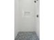 Modern shower with white subway tile, a built-in niche, and a shower head with matching faucet at 591 Island Walk East, Mount Pleasant, SC 29464