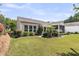 Well-maintained backyard featuring verdant lawn, mature trees, and manicured landscaping at 602 Eastern Isle Ave, Summerville, SC 29486