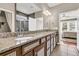 Bright bathroom featuring double sinks with granite countertops and decorative cabinets at 602 Eastern Isle Ave, Summerville, SC 29486
