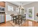 Dining area adjacent to the kitchen, featuring hardwood floors and backyard view at 602 Eastern Isle Ave, Summerville, SC 29486