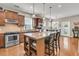 Modern kitchen featuring a central island with bar seating, granite countertops, and stainless steel appliances at 602 Eastern Isle Ave, Summerville, SC 29486