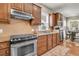 Close up of a modern kitchen area with stainless steel oven and granite countertops with wood accents at 602 Eastern Isle Ave, Summerville, SC 29486