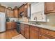 A closer view of the well-lit kitchen area showing the stainless steel sink and granite countertops at 602 Eastern Isle Ave, Summerville, SC 29486