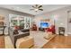 Spacious living room with large windows, stylish furnishings, and hardwood flooring at 602 Eastern Isle Ave, Summerville, SC 29486