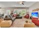 Spacious living room with large windows offering natural light and outdoor views at 602 Eastern Isle Ave, Summerville, SC 29486