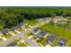 Overhead view of the suburban neighborhood featuring manicured lawns, sidewalks, and tree-lined streets at 602 Jancus St, Charleston, SC 29414