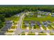 A high angle view of the neighborhood showcasing well maintained homes, green spaces, and community pond at 602 Jancus St, Charleston, SC 29414