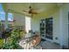 Covered back patio with ceiling fan, outdoor seating, BBQ grill, rose bush and access to home at 602 Jancus St, Charleston, SC 29414