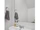 Clean and modern half bathroom featuring a sleek sink, stylish fixtures, and a neutral color palette at 602 Jancus St, Charleston, SC 29414